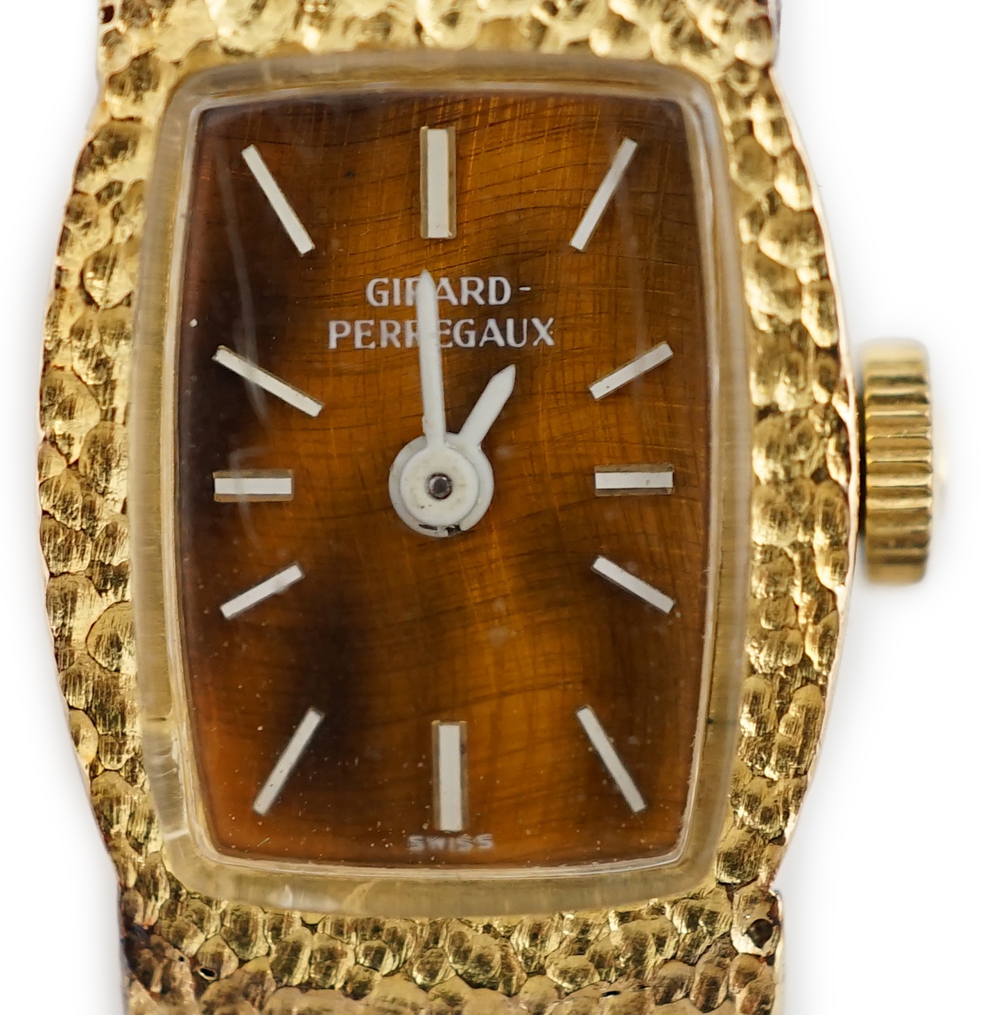 A lady's Girard Perregaux 18K yellow gold wrist watch, with tiger's eye quartz dial, white hands and markers, on integral textured close-link flexible bracelet with clasp